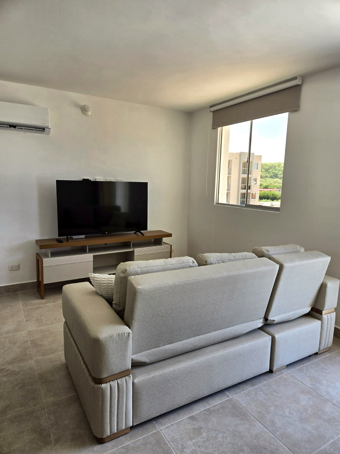 Capriella living room sofa facing the television