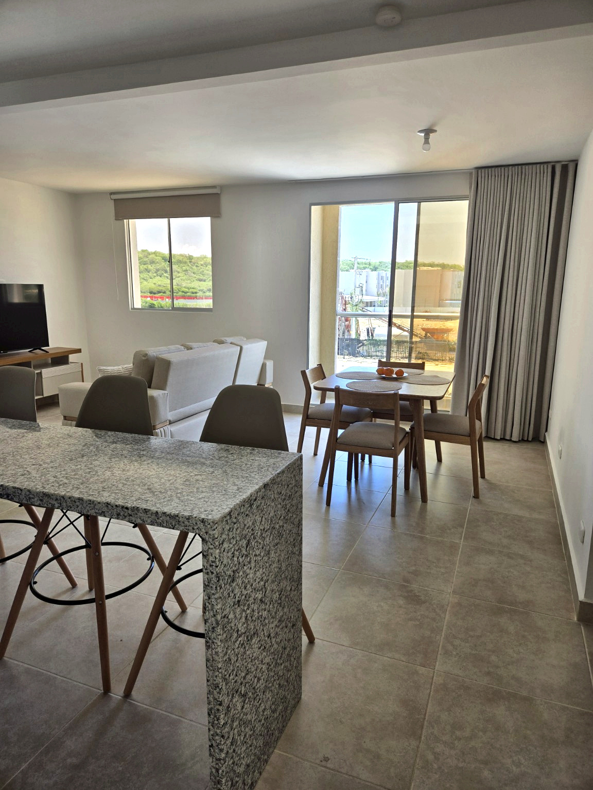 Capriella kitchen counter overlooking the living and dining areas